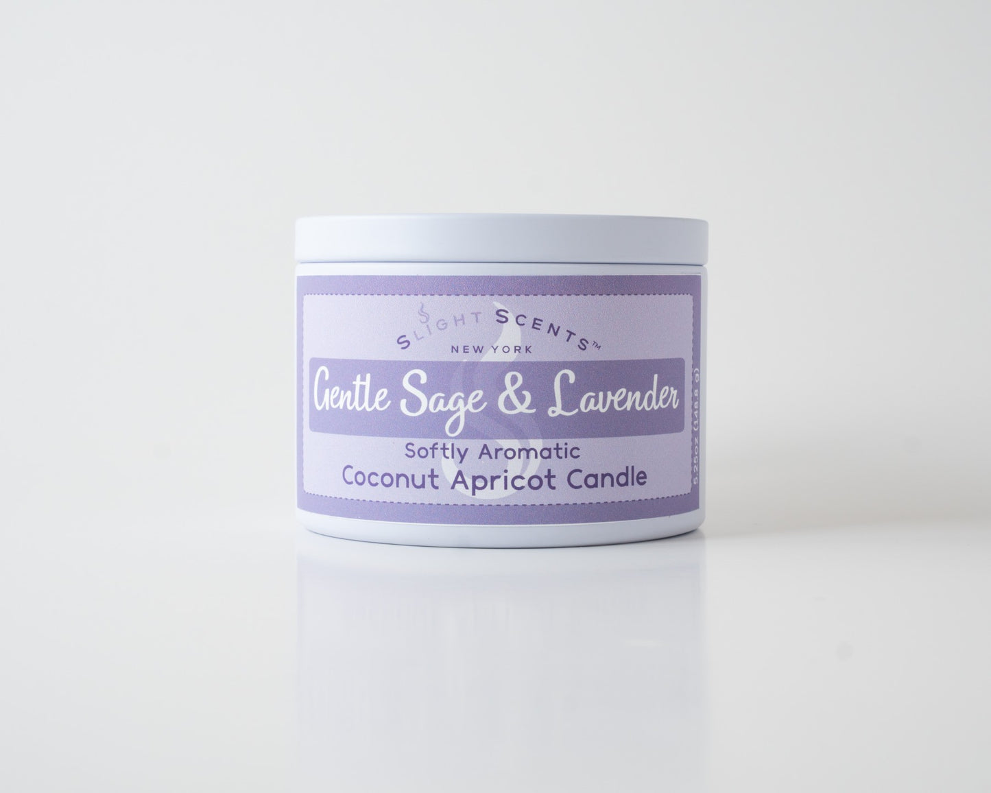 Gentle Sage & Lavender Coconut Apricot Candle By Slight Scents New York in a white metal tin on a white background.