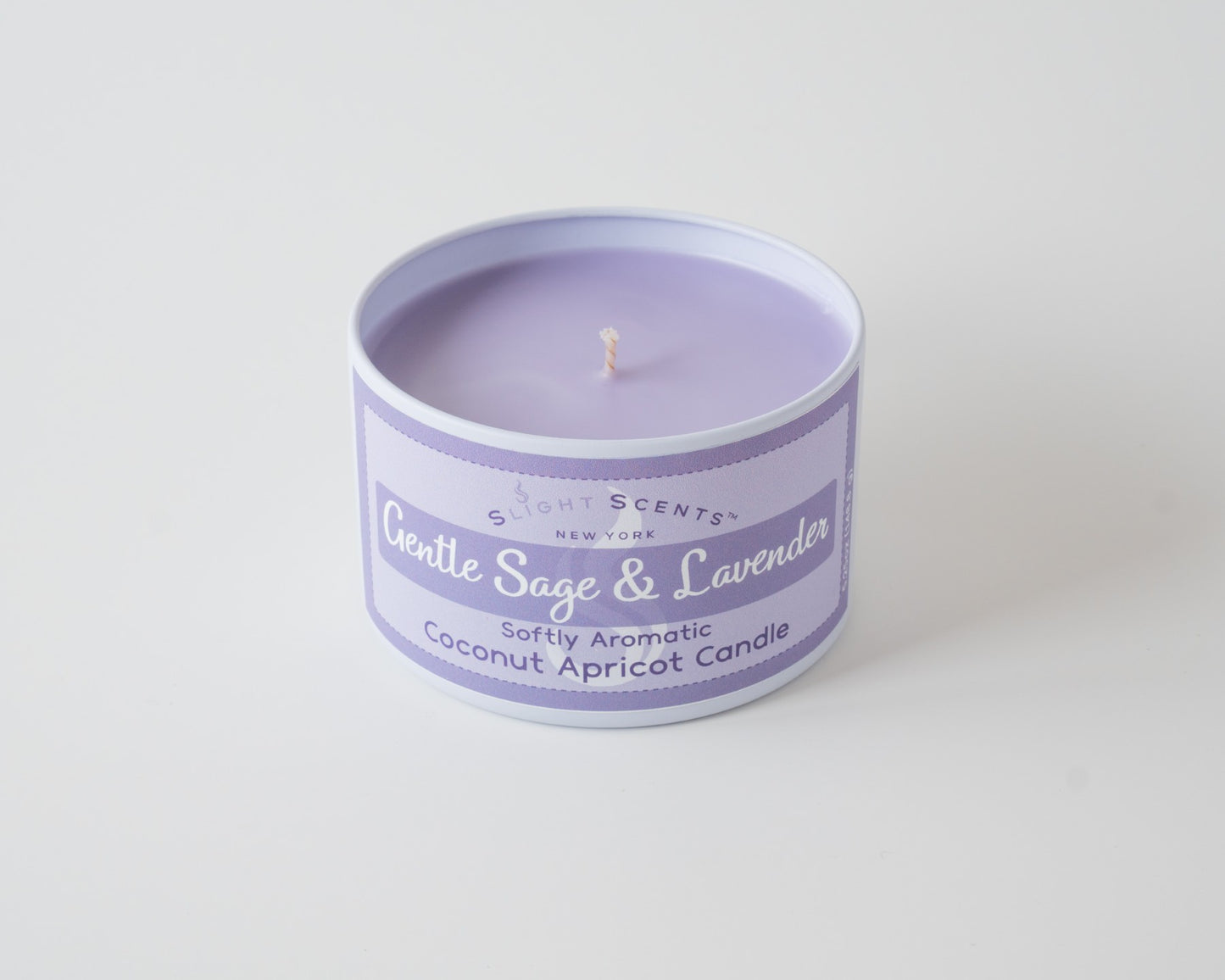 Gentle Sage & Lavender Coconut Apricot Candle By Slight Scents New York in a white metal tin on a white background without a lid.