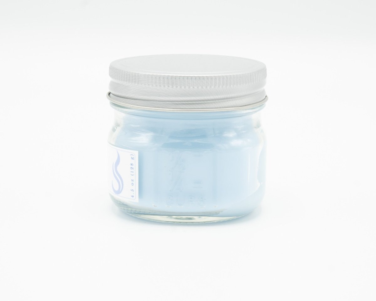 Light Linen Coconut Apricot Candle in a 4.5oz mason jar. Side view.