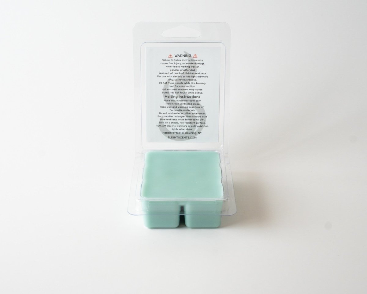 Spiced Cream wax melt on a white background. Open clam shell container.