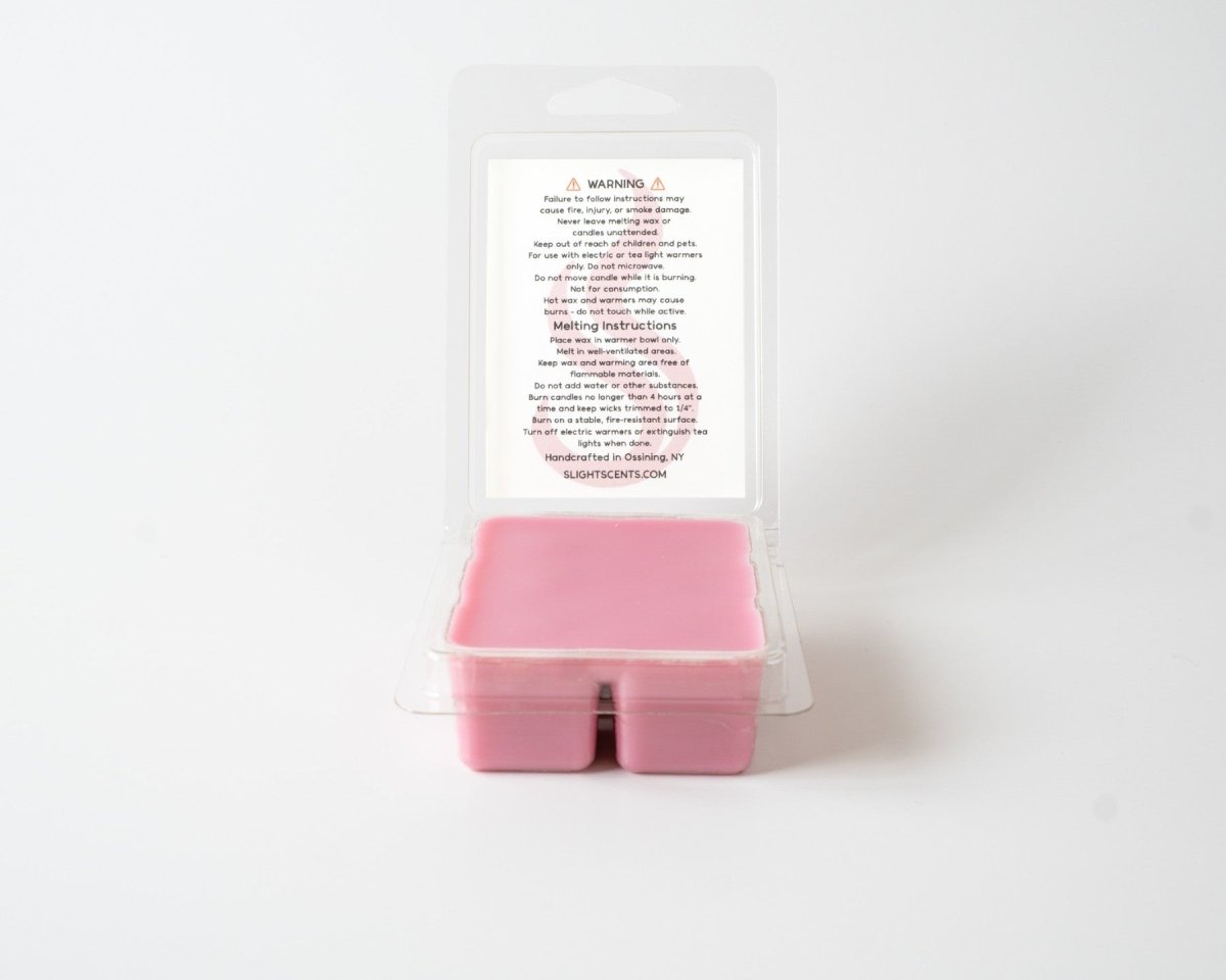 Sweet Black Raspberry wax melt on a white background. Open clam shell container.