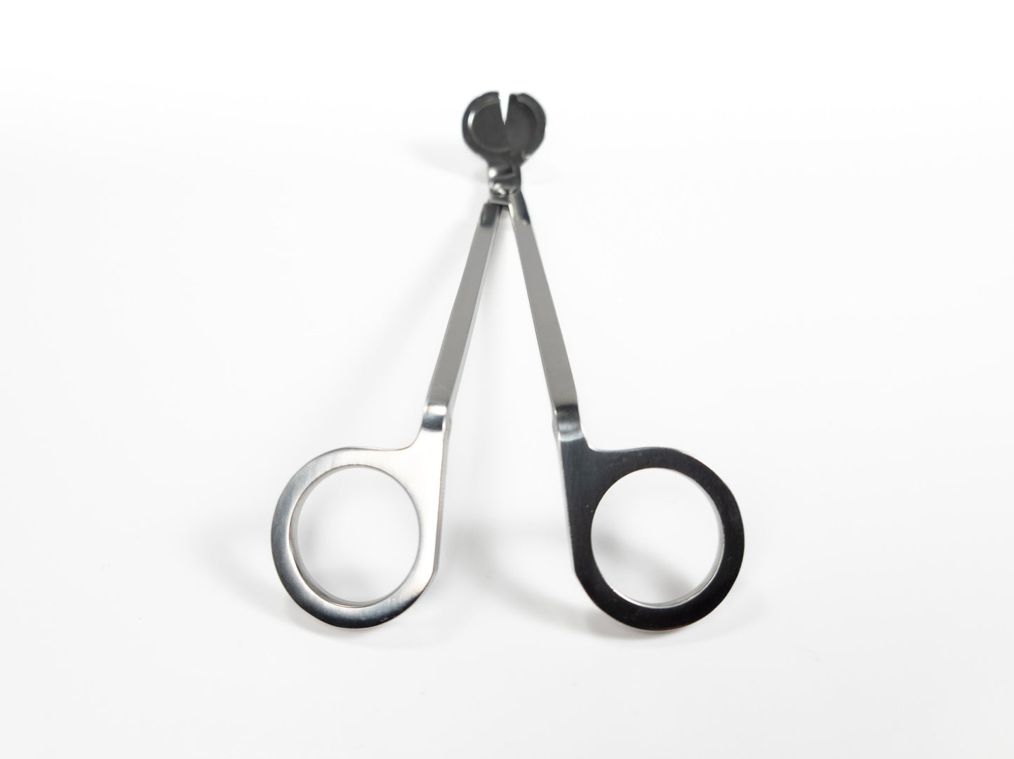 Stainless steel wick trimmers with a sleek, polished finish and angled blades, displayed on a white background. Rear Profile.