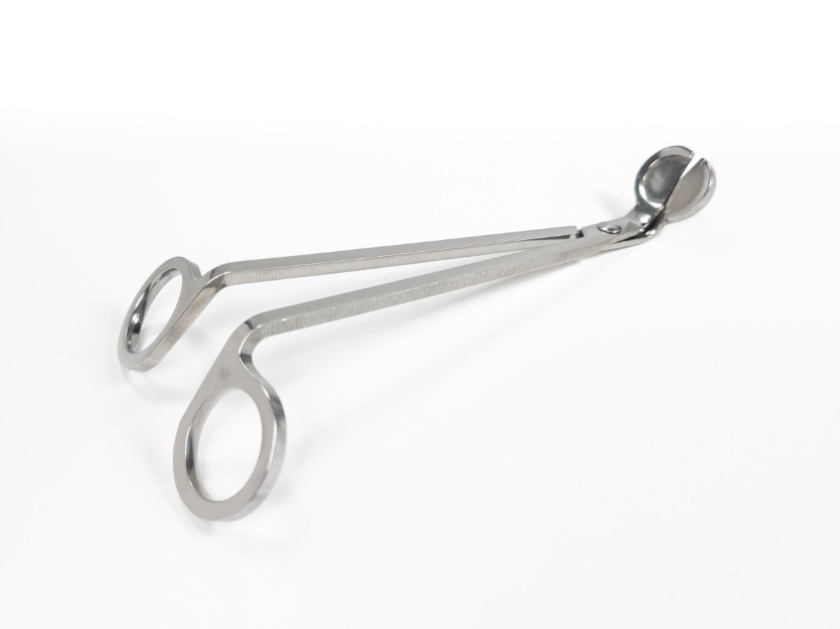 Stainless steel wick trimmers with a sleek, polished finish and angled blades, displayed on a white background. Side Profile.