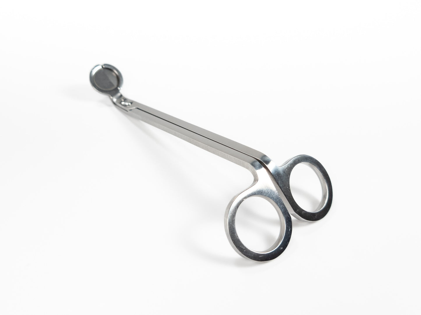 Stainless steel wick trimmers with a sleek, polished finish and angled blades, displayed on a white background. Top Profile.