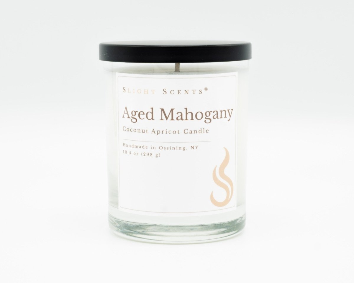 Aged Mahogany Softly Aromatic Coconut Apricot Candle by Slight Scents New York against a white background.