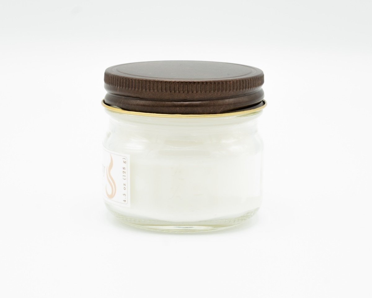 Coconut Apricot Candle in a 4.5oz mason jar. Side view.