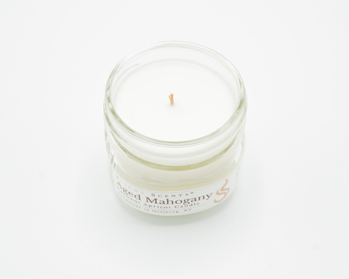 Aged Mahogany Coconut Apricot Candle in a 4.5oz mason jar without a lid.