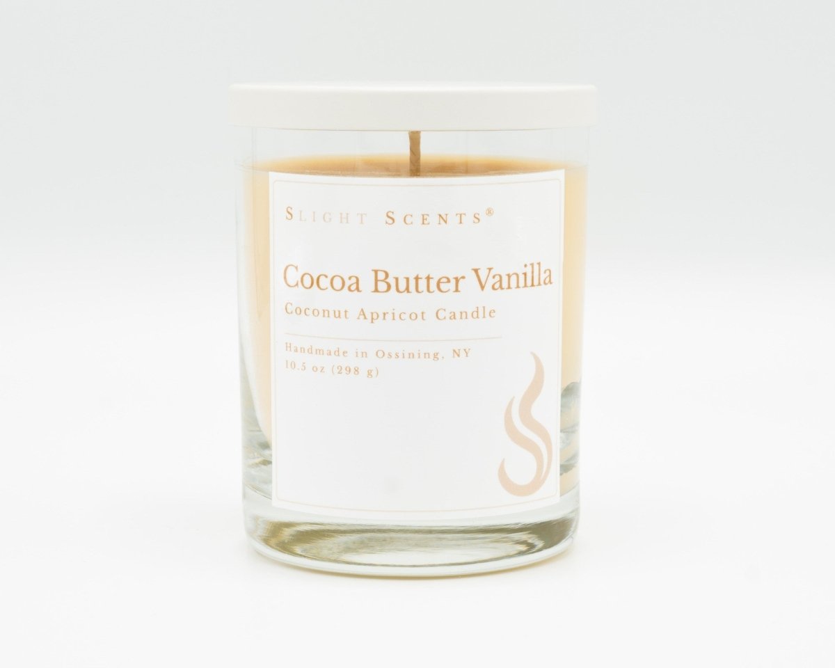 Cocoa Butter Vanilla Softly Aromatic Coconut Apricot Candle by Slight Scents New York against a white background.