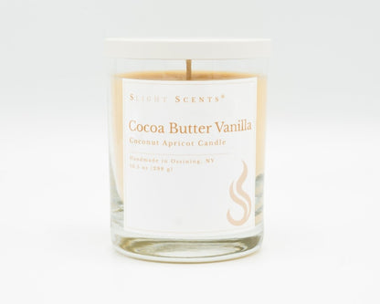 Cocoa Butter Vanilla Softly Aromatic Coconut Apricot Candle by Slight Scents New York against a white background.