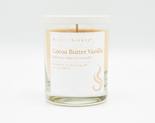 Cocoa Butter Vanilla Softly Aromatic Coconut Apricot Candle by Slight Scents New York against a white background.