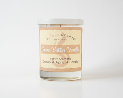 Cocoa Butter Vanilla Softly Aromatic Coconut Apricot Candle by Slight Scents New York against a white background.