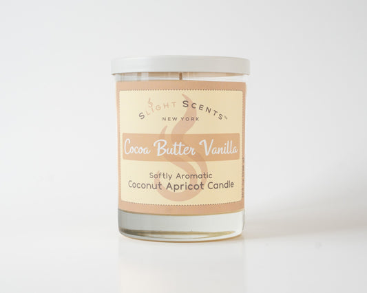 Cocoa Butter Vanilla Softly Aromatic Coconut Apricot Candle by Slight Scents New York against a white background.