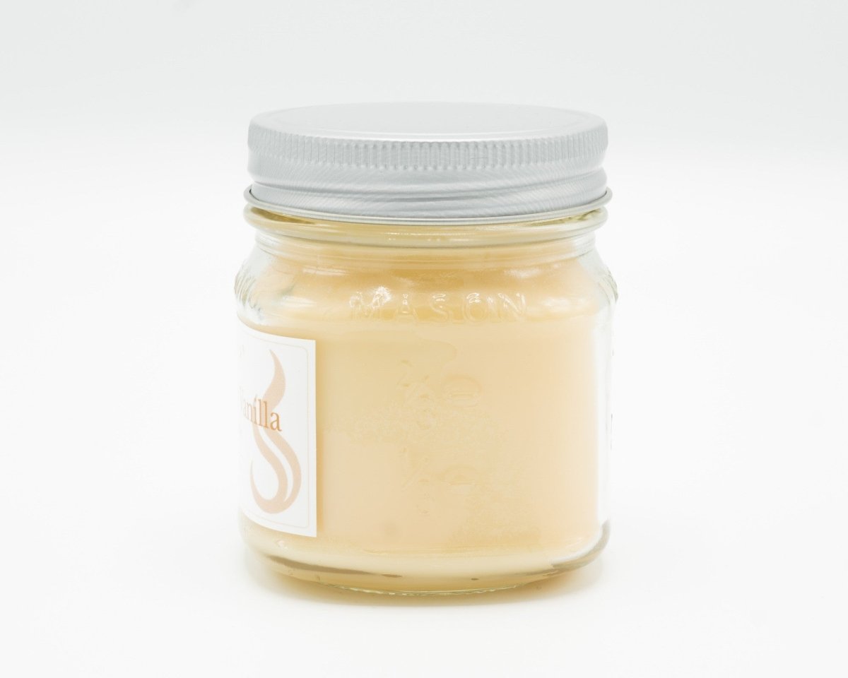Cocoa Butter Vanilla Coconut Apricot Candle in a 8oz mason jar. Side view.