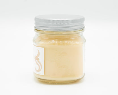 Cocoa Butter Vanilla Coconut Apricot Candle in a 8oz mason jar. Side view.