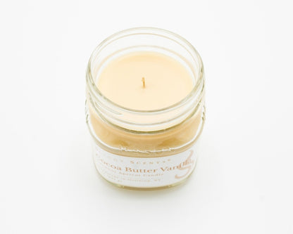 Cocoa Butter Vanilla Coconut Apricot Candle in a 8oz mason jar without a lid.