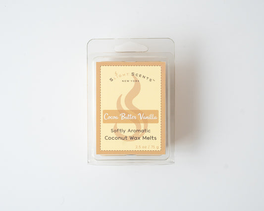 Cocoa Butter Vanilla wax melt on a white background. Closed clam shell container.