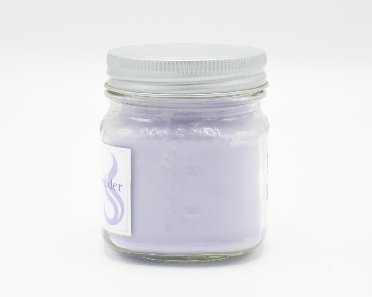 Gentle Sage & Lavender Coconut Apricot Candle in a 8oz mason jar. Side view.