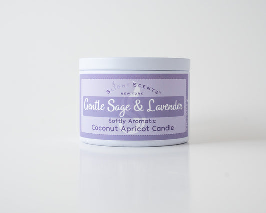 Gentle Sage & Lavender Coconut Apricot Candle By Slight Scents New York in a white metal tin on a white background.