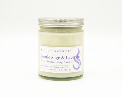 Front view of an Gentle Sage and Lavender odor neutralizing candle with white label, undyed wax, and silver metal lid in a glass jar. 