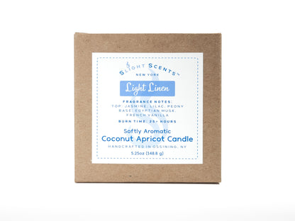 Candle box for Slight Scents New York featuring the fragrance Light Linen with notes of jasmine, lilac, peony, Egyptian musk, and French vanilla. Softly Aromatic coconut apricot candle, 5.25 oz, with a burn time of 25+ hours. Handcrafted in Ossining, NY.