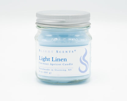 Light Linen Coconut Apricot Candle in a 8oz mason jar. Front view. 