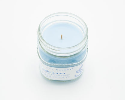 Light Linen Coconut Apricot Candle in a 8oz mason jar without a lid. 