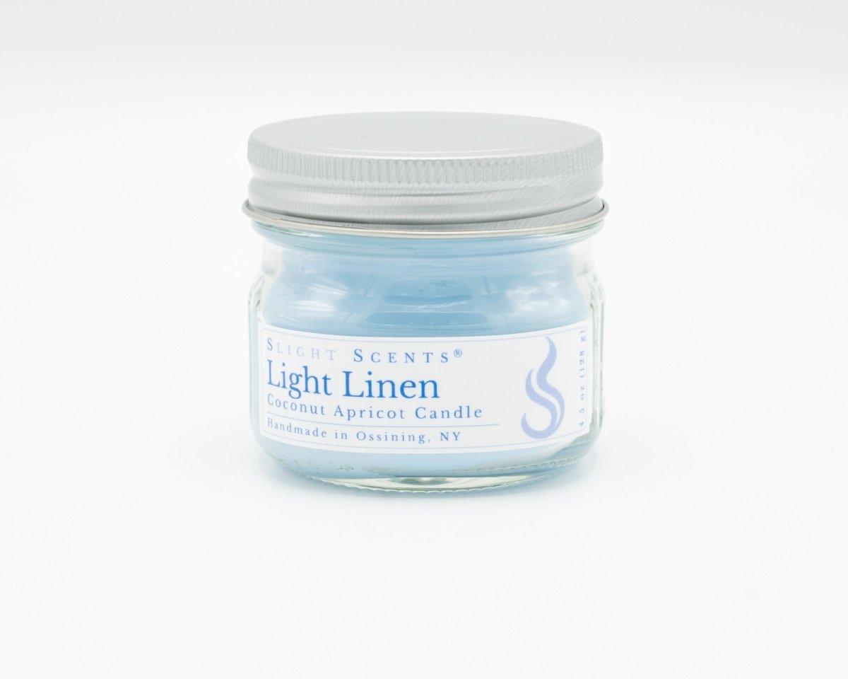 Light Linen Coconut Apricot Candle in a 4.5oz mason jar. Front view. 