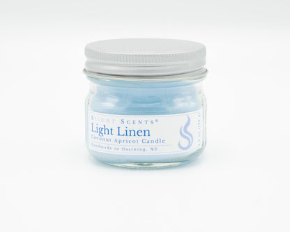 Light Linen Coconut Apricot Candle in a 4.5oz mason jar. Front view. 