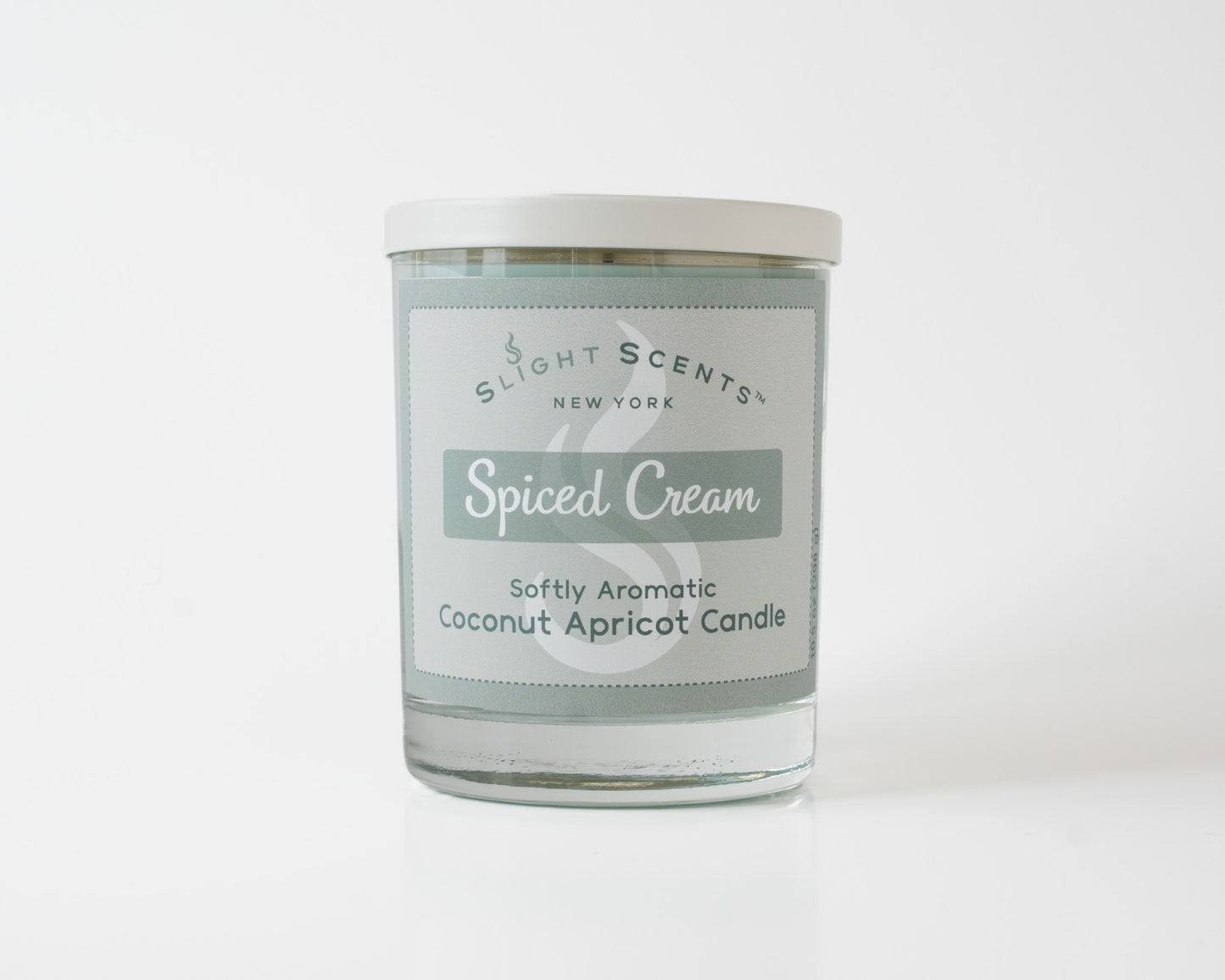 Spiced Cream Softly Aromatic Coconut Apricot Candle by Slight Scents New York against a white background.
