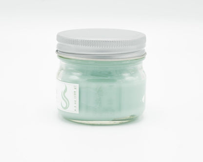 Spiced Cream Coconut Apricot Candle in a 4.5oz mason jar. Side view.