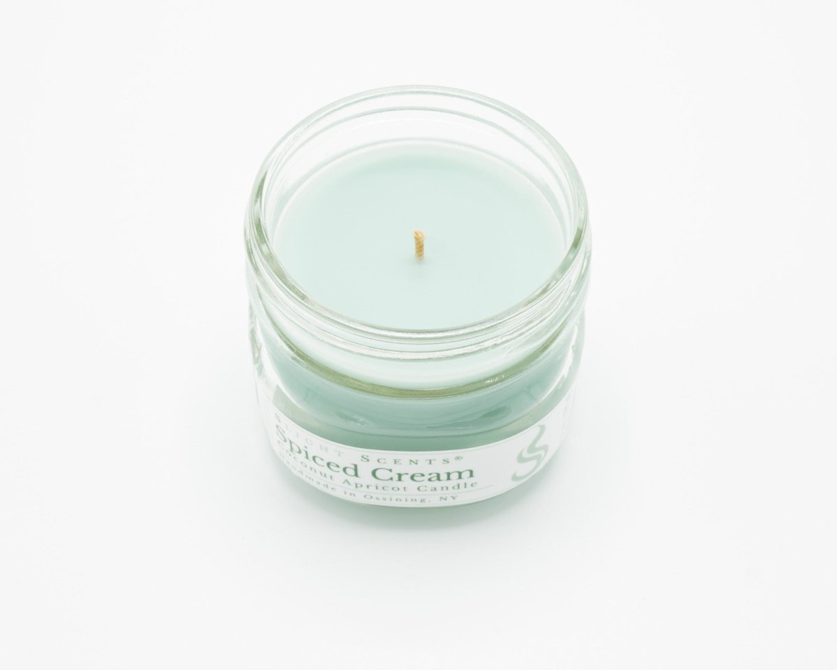 Spiced Cream Coconut Apricot Candle in a 4.5oz mason jar without a lid.
