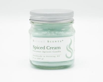 Spiced Cream Coconut Apricot Candle in a 8oz mason jar. Front view.