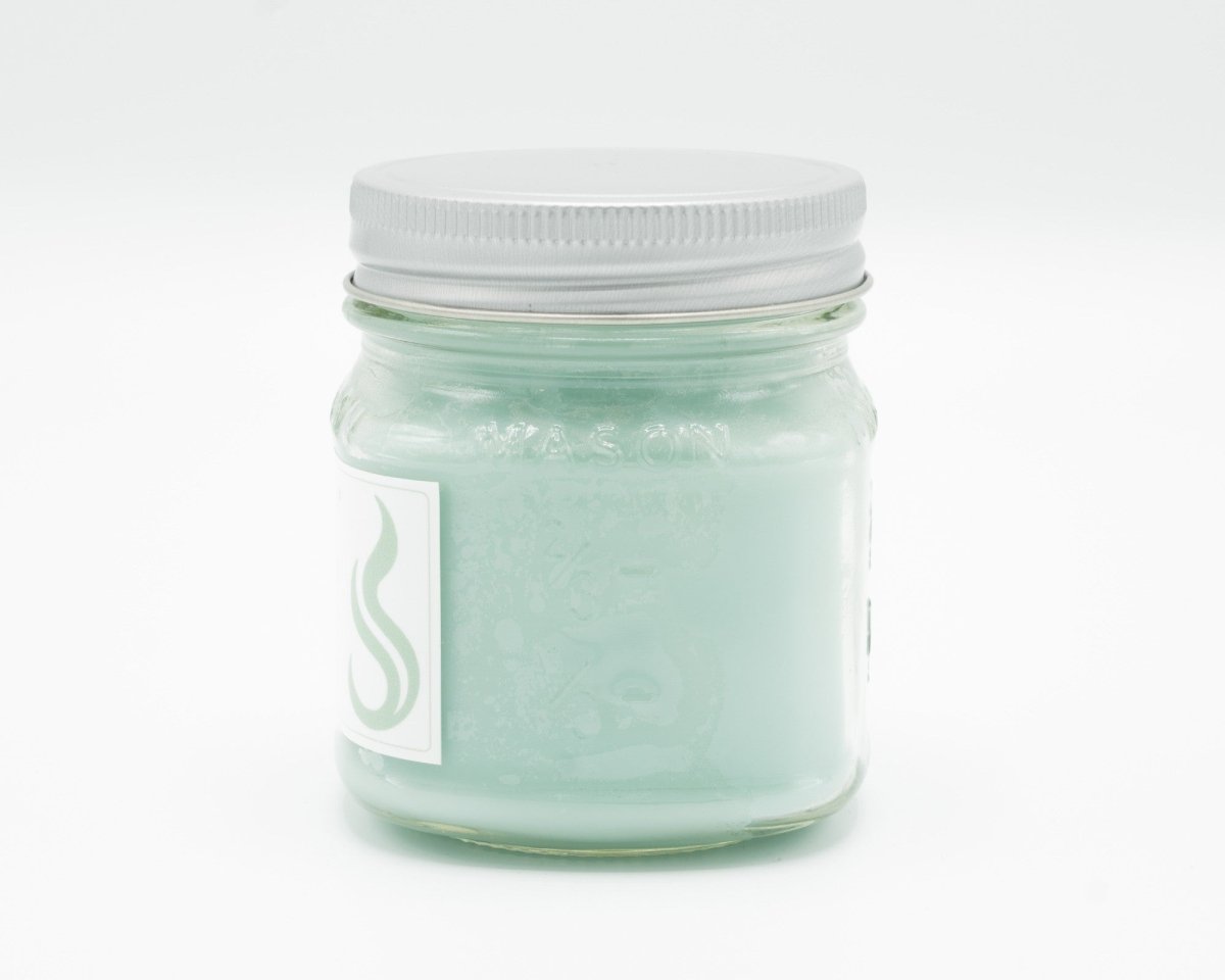 Spiced Cream Coconut Apricot Candle in a 8oz mason jar. Side view.