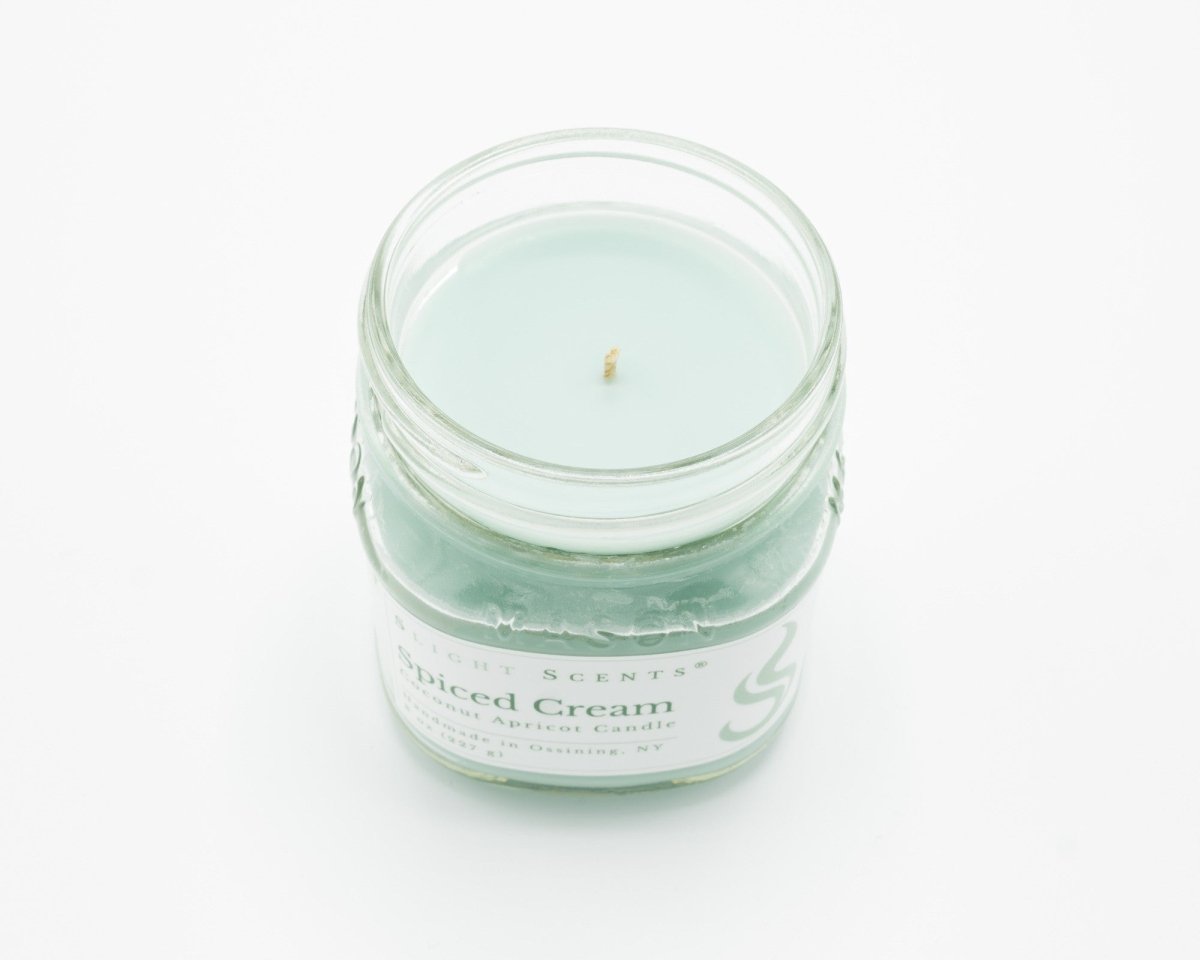 Spiced Cream Coconut Apricot Candle in a 8oz mason jar without a lid.