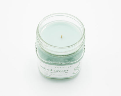 Spiced Cream Coconut Apricot Candle in a 8oz mason jar without a lid.