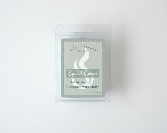 Spiced Cream wax melt on a white background. Closed clam shell container.