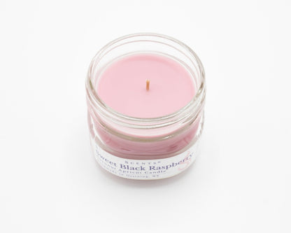 Sweet Black Raspberry Coconut Apricot Candle in a 4.5oz mason jar without a lid.