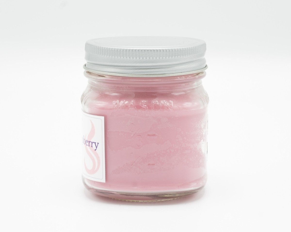 Sweet Black Raspberry Coconut Apricot Candle in a 8oz mason jar. Side view.