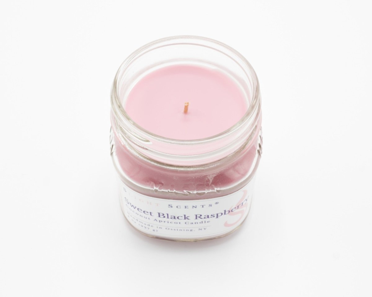 Sweet Black Raspberry Coconut Apricot Candle in a 8oz mason jar without lid.