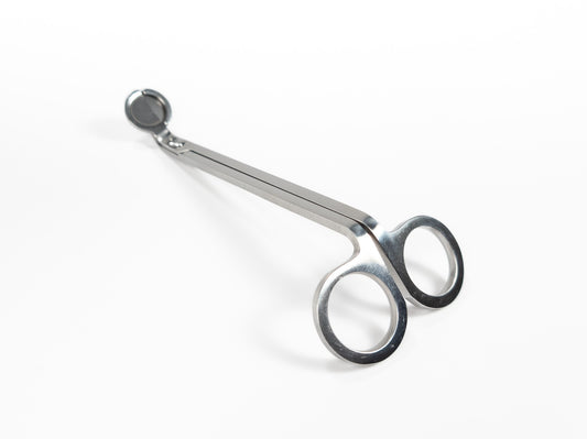 Stainless steel wick trimmers with a sleek, polished finish and angled blades, displayed on a white background. Top Profile.